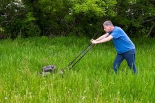 man-lawnmower-mowing-tall-grass-big-large-lawn-homeowner-mower-push-type-male-making-his-way-414.jpg