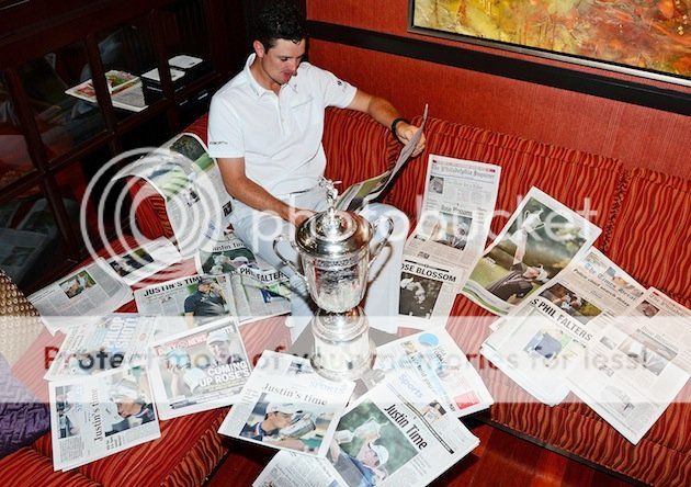 06golfjustinrosetrophyandnewspapers.jpg