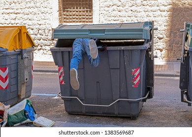 dumpster-diving-man-denim-jeans-260nw-1383569687.jpg