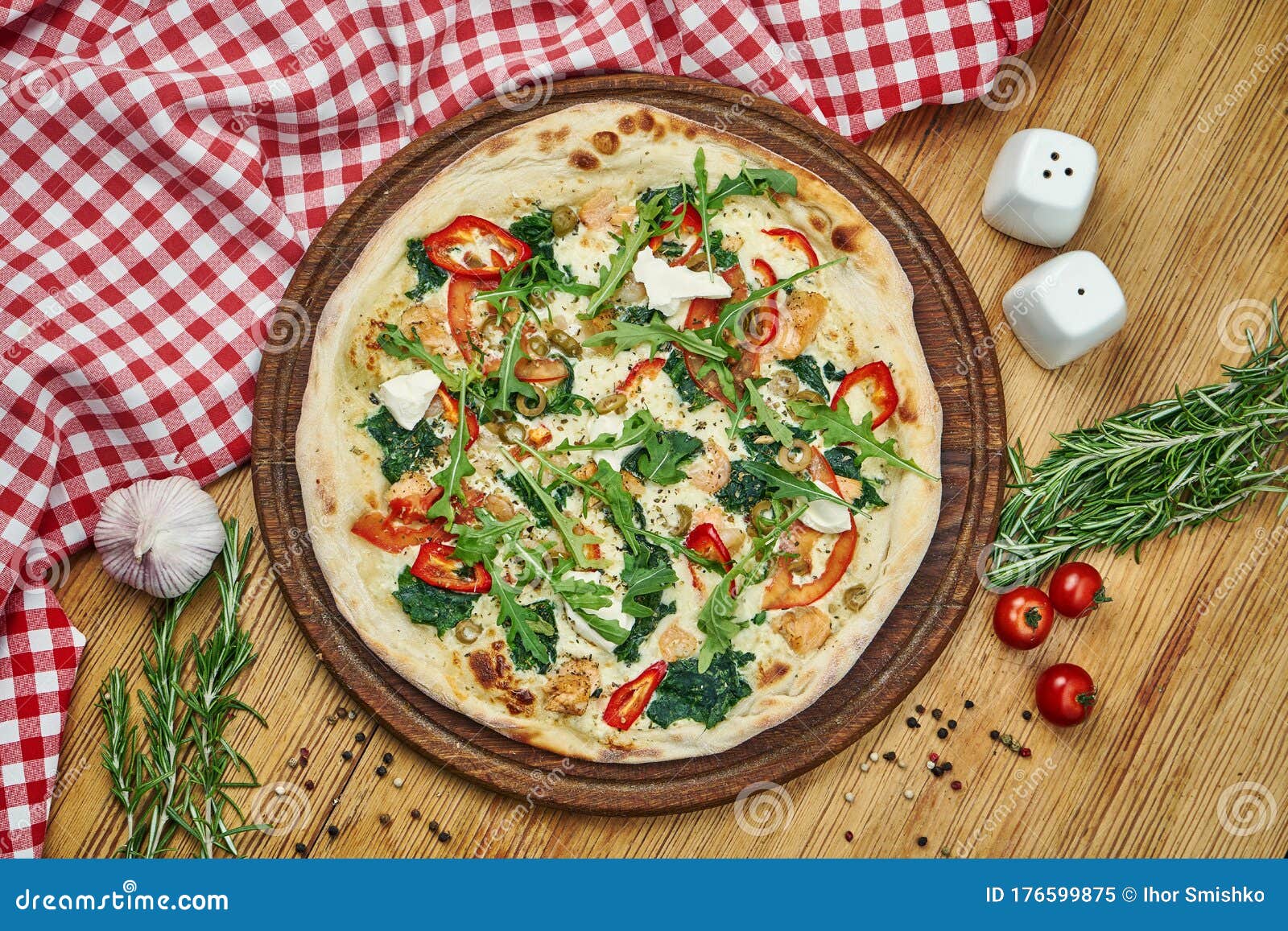 pizza-philadelphia-cheese-tomatoes-olives-arugula-shrimp-white-sauce-wooden-tray-pizza-composition-pizza-176599875.jpg